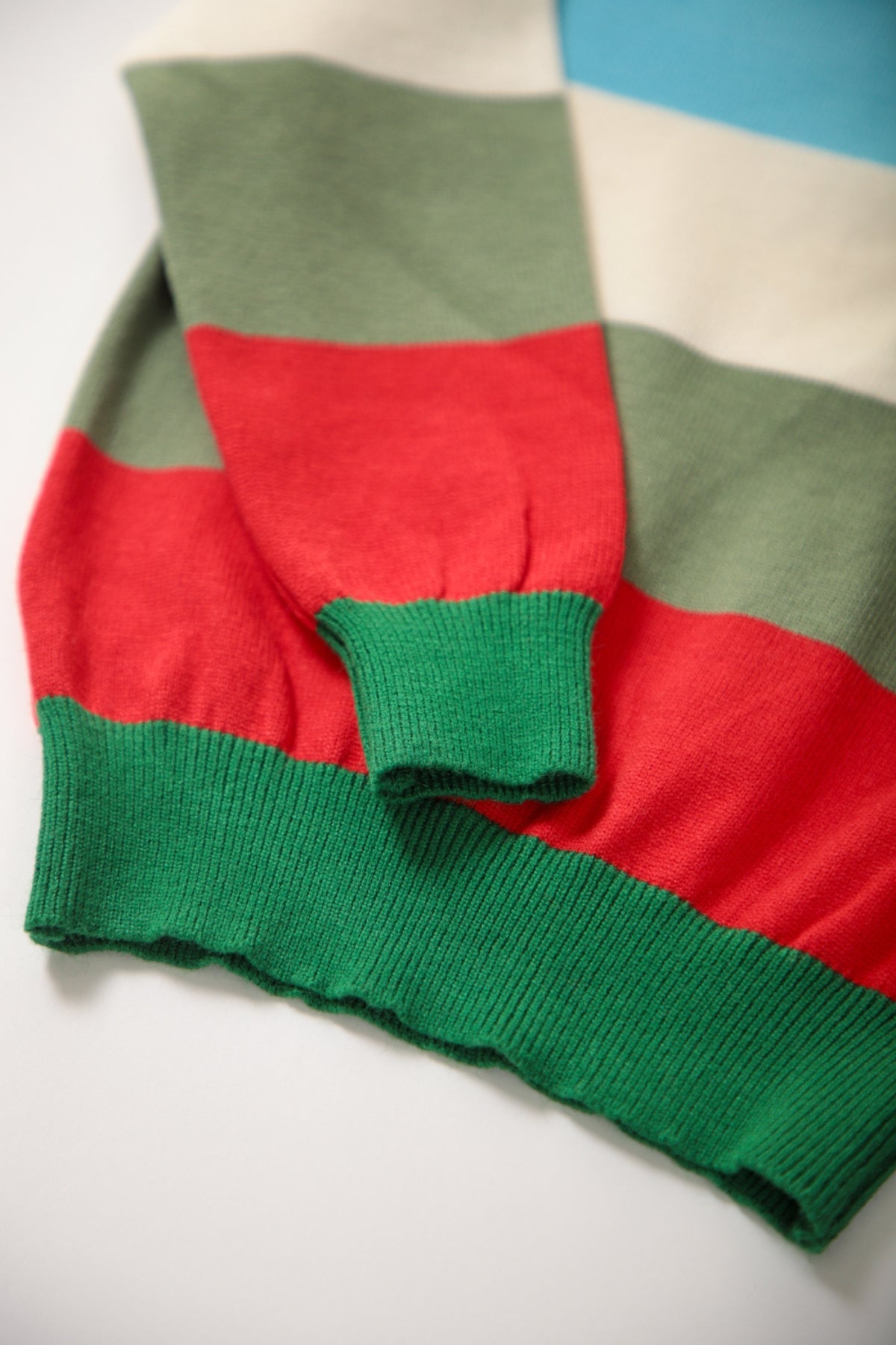 Collection of Clorful jumper for boys with animal painted green in a gallery layout